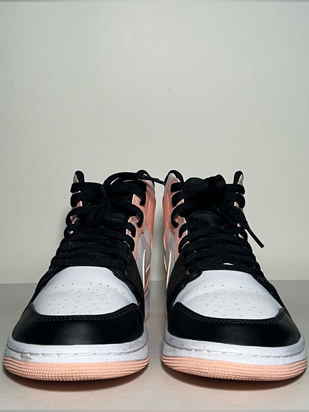 Air Jordan 1 Mid Black White and Pink Sneakers